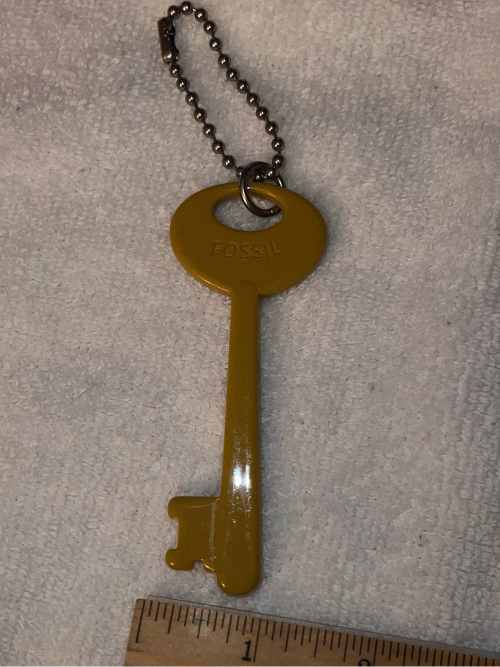 Fossil skeleton key mustard yellow plastic charm fob metal ball chain